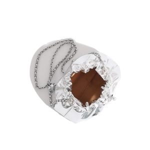 Top view of silver metallic pleated bucket bag with signature chain strap and brown lining