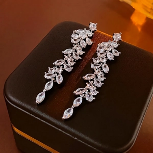 Elegant long drop silver needle earrings with zircon branch tassels on a black gift box