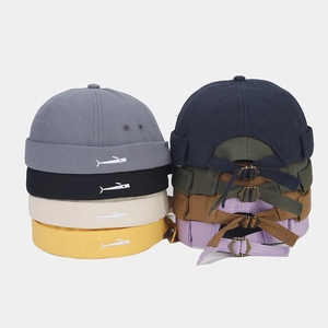 Docker hat collection in multiple colors featuring small fish embroidery and metal buckle