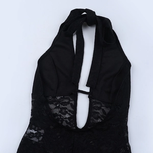 Close-up of intricate lace patterns and halter neck detail on black slim jumpsuit