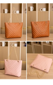 Detailed view of the V-quilted faux leather tote bag with elegant gold chain straps