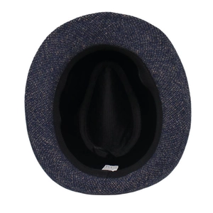 Detail of blue tweed fedora hat interior showing woven fabric texture and sizing label