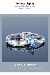 Close-up of S925 sterling silver couple rings featuring antler design and blue gemstone