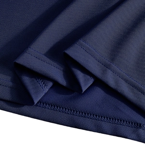Macro shot of breathable navy blue pique knit fabric with durable double-stitched hem