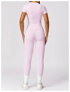 Slim fit light purple gym set featuring high waist leggings and short sleeve top back view
