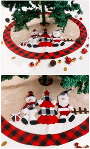 Close-up of Santa and Snowman embroidery on buffalo plaid Christmas tree skirt