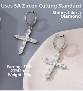 Close-up of silver cross earrings with 5A cubic zirconia stones and 21x42mm size label