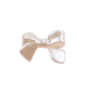 Lustrous resin pearl bow tie bead for DIY phone chains on a white background