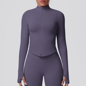 Detail view of mauve yoga jacket featuring stand collar, front zipper, and thumbhole cuffs