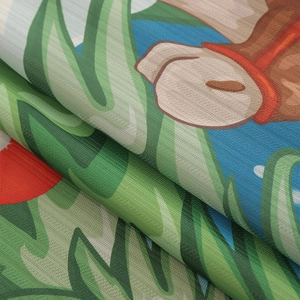 Detailed macro view of premium blackout fabric showing floral pattern and woven texture