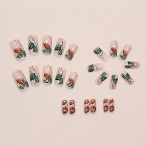 Sparkling leaf press-on nails set with beige glitter base and autumn leaf pattern art