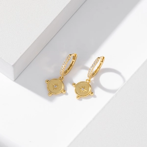 Elegant gold S925 silver huggie earrings with sparkling starburst disc charms for women