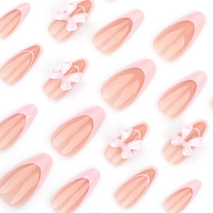 Faux ongles French roses avec nœuds 3D de style ballerine forme amande