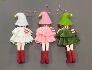 Detail view of handmade Christmas elf hanging ornaments in pink, white, and green outfits