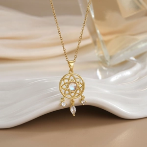 Elegant gold-plated dreamcatcher necklace with iridescent gemstone and dangling charms