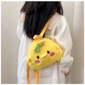Rear view of a child wearing a cute plush yellow chick backpack with soft green leaf detail