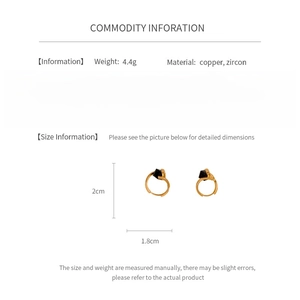 Detail view of 2cm gold copper earrings with black zircon and size dimensions
