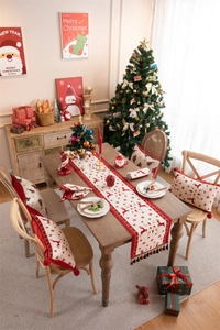 Close-up of jacquard Christmas table runner featuring reindeer and snowflake patterns