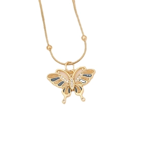 Gold butterfly pendant necklace with enamel details and zircon on white background