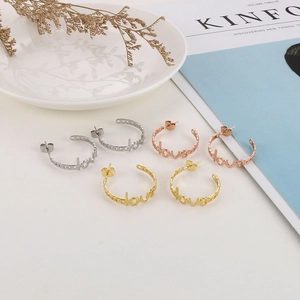 Three pairs of vintage LOVE letter C-shape earrings in silver, rose gold, and gold finish