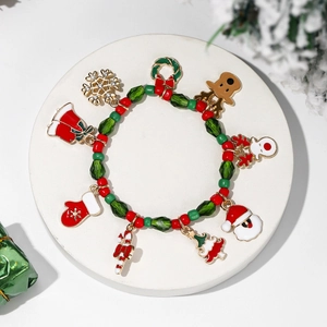 Christmas beaded bracelet with Santa Claus and reindeer charms on a white stone base