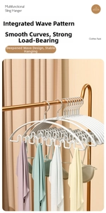 Close-up of white wave-shaped hanger with deep U-slots for non-slip storage