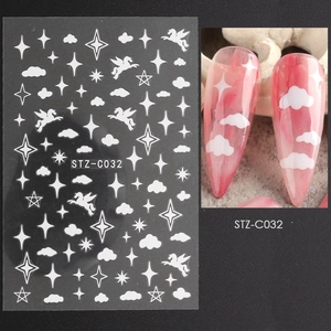 Detail of white cloud and star nail stickers with Pegasus design for DIY manicure
