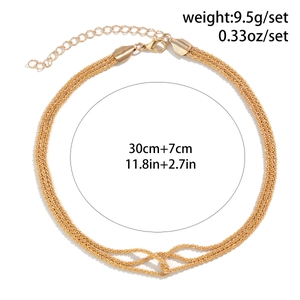 Detail showing multi-layer gold chain necklace with 30cm length and 7cm extension