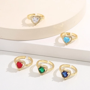 Detailed view of adjustable heart rings in five zircon colors on geometric displays