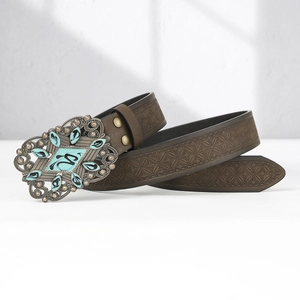 Brown leather belt featuring a vintage metal buckle with turquoise stone and embossing