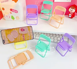 Close-up of colorful mini folding chair phone stands in macaron purple and yellow tones