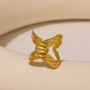 Minimalist gold-plated adjustable ring featuring a textured cross-wrap ribbon design