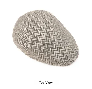 Top view showing the classic herringbone tweed texture and weave of the British newsboy cap