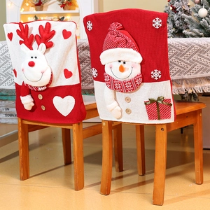 Detail of 3D reindeer and snowman Christmas chair covers in festive red and white knit fabric