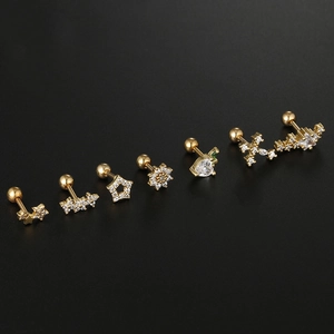 Macro shot of 6 gold stainless steel stud earrings with zircon stars and hearts