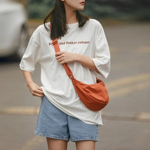 Minimalist orange canvas dumpling crossbody bag for casual outdoor commute and travel
