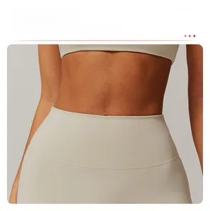 Detail of high-waist yoga leggings with curved seams for waist lifting in oatmeal gray