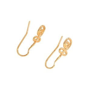 Detailed macro shot of gold minimalist hoop earrings with delicate swirl texture details