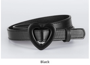 Detail of children's PU leather belt featuring a black heart-shaped buckle and stitching