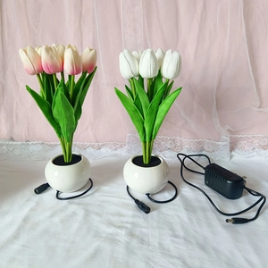 Detail showing artificial tulip LED night lamps with ceramic pots and DC power cables