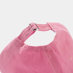 Detail of pink cotton baseball cap with adjustable silver metal buckle and neat stitching