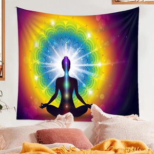 Close-up of mandala yoga tapestry with seven chakras hanging over a bedroom bed