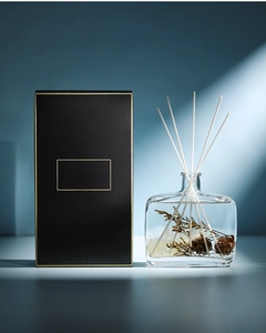 Detail view of WIACHNN reed diffuser set with dried flowers and pine cones in glass bottle