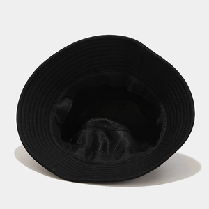 Detail view of the breathable mesh lining and reinforced stitching inside the black bucket hat