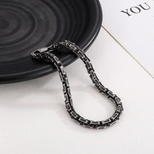 Detail shot of vintage silver industrial chain bracelet with rustic matte texture and lobster clasp