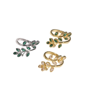 Adjustable leaf rings set with emerald and pink gemstones in gold and silver plating