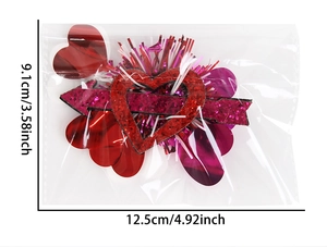 Detailed view of red heart hair accessory with dimensions 12.5cm by 9.1cm in packaging