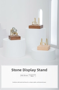 Close-up of H65 brass wire bracket and black walnut base for crystal stone display