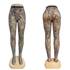 Floral lace fishnet tights in black with intricate flower pattern and high waist band