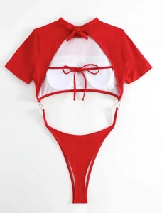 Detail of red hollow swimsuit with metal ring connectors and lace-up back design